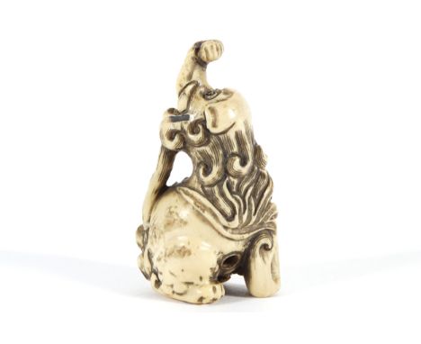 CARVED NETSUKE of a mythical animal