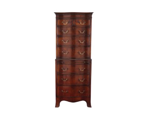 GEORGE III STYLE CHIPPENDALE SERPENTINE CHEST-ON-CHESTof two short and six long drawers, with a central brushing slide, raise