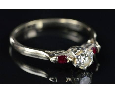 A LATE 20TH CENTURY THREE STONE DIAMOND AND RUBY RING, estimated modern round brilliant cut weight 0.30ct, colour assessed as
