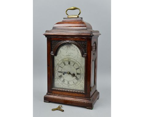 A GEORGE III AND LATER MAHOGANY AND STAINED CASED BRACKET CLOCK, brass carry handle above caddy top, moulded glass door enclo