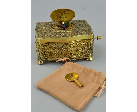 A 20TH CENTURY GERMAN SILVER GILT BIRD AUTOMATON MUSIC BOX, the case decorated with putti, foliate scrolls, birds and musical