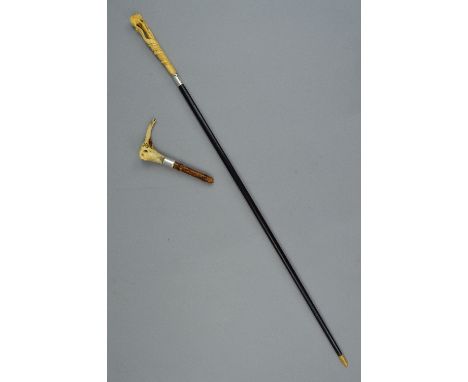 A LATE VICTORIAN BONE WALKING CANE HANDLE IN THE FORM OF AN ELEPHANT'S HEAD, with silver collar, maker's mark WD, London 1881