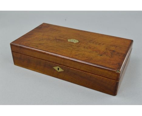 A VICTORIAN WALNUT RECTANGULAR GAMING BOX, the lid inset with card suits cartouche, brass lozenge escutcheon, the interior fi