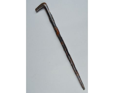 A 19TH CENTURY CARVED WALKING STICK WITH SOLDIERS ON HORSEBACK, decapitated head and horse's leg, a standing soldier and anim