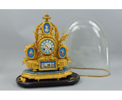 A 19TH CENTURY GILT METAL AND PORCELAIN MOUNTED MANTEL CLOCK, urn surmount above an oval painted plaque of a lady within a fo