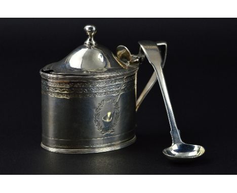 A GEORGE III OVAL SILVER MUSTARD POT, hinged domed cover with ball finial, engraved foliate decoration, blue glass liner, mak