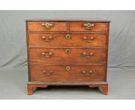 A GEORGE III MAHOGANY CHEST OF TWO SHORT AND THREE LONG GRADUATED DRAWERS, shaped brass escutcheons and swan neck handles, br