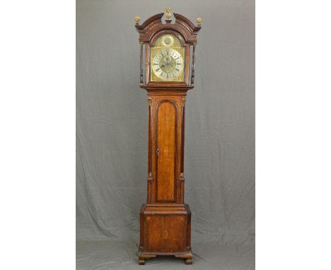 A GEORGE III OAK, MAHOGANY BANDED AND INLAID LONGCASE CLOCK, the hood with broken arch pediment and three gilt metal ball sur