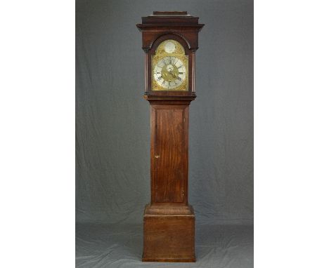 A GEORGE III MAHOGANY LONG CASE CLOCK, the hood with caddy top on half column supports flanking arched door, the brass face w