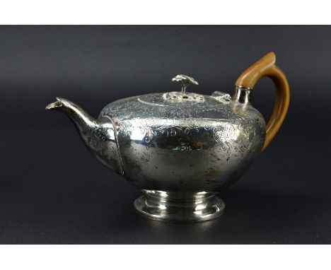A GEORGE III TEAPOT, of flattened bullet form, the finial cast as two flowers and leaves, the cover, shoulders and sides of t
