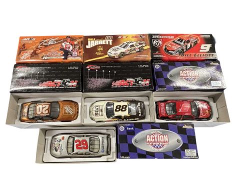 Four boxed 1:24 scale NASCAR models