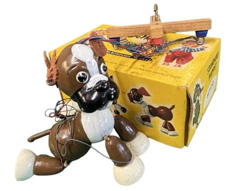 A boxed Bengo the Boxer Pelham puppet