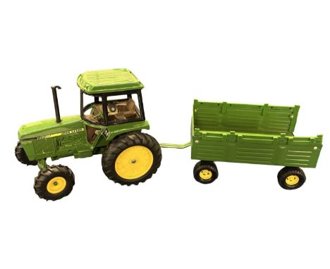 An ERTL 1:32 scale John Deere  tractor and trailer