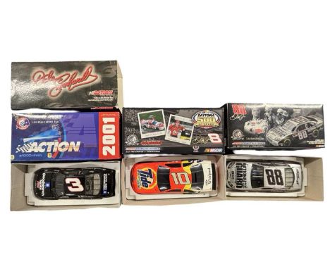 Three boxed 1:24 scale NASCAR models, to include:  - Dale Earnhardt #3 GM Goodwrench Service Pluss 2001 Monte Carlo - Dale Ea