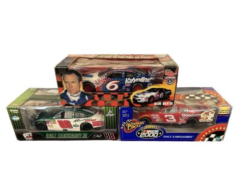 Three boxed 1:24 scale NASCAR models
