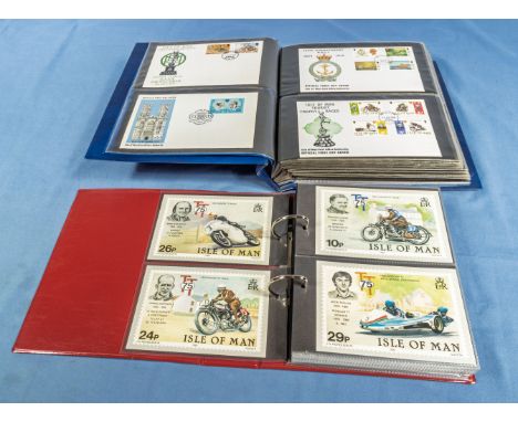 Two folders containing Isle of Man postcards and first day covers 1982-1985