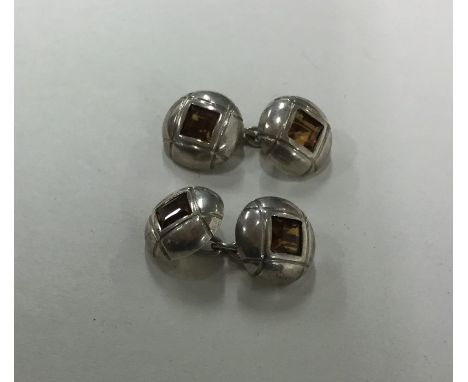A pair of silver engine turned cufflinks. Approx. 17 grams. Est. £10 - £20.