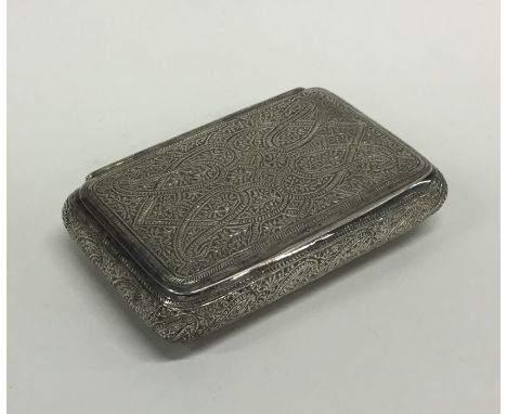 A Persian silver snuff box with hinged lid attractively decorated with scrolls and flowers. Approx. 100 grams. Est. £100 - £1