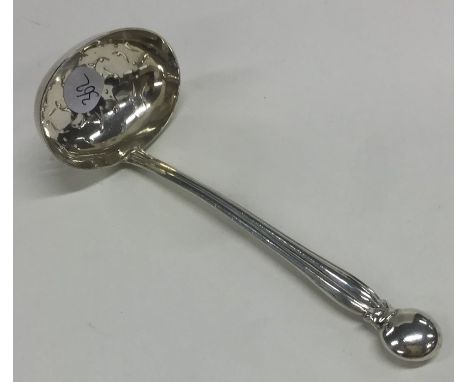 A silver pierced sifter ladle with fluted handle. Birmingham 1892. Approx. 23 grams. Est. £20 - £30.