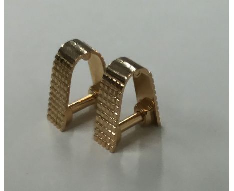 A pair of heavy French 18 carat rose gold cufflinks of engine turned design. Approx. 10 grams. Est. £350 - £450.