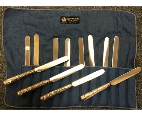 PAUL STORR: A set of twelve silver shell decorated knives with steel blades. Approx. 606 grams. Est. £650 - £750.