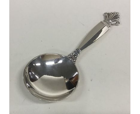 GEORG JENSEN: A stylish silver caddy spoon of textured form. Approx. 24 grams. Est. £45 - £55.