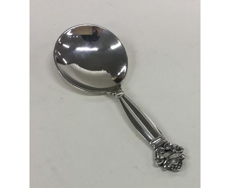 GEORG JENSEN: A stylish silver caddy spoon of textured form. Approx. 24 grams. Est. £45 - £55.