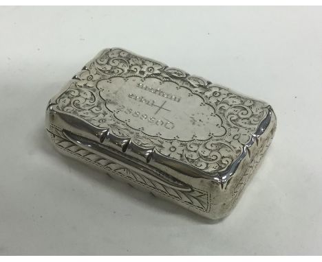 An Edwardian silver snuff box with engraved decoration to hinged top. Chester. Approx. 35 grams. Est. £40 - £60.