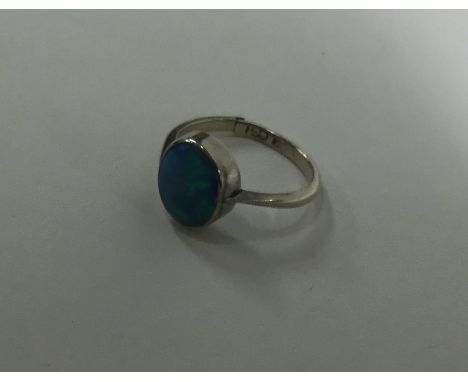 A 9 carat opal single stone ring. Approx. 2.1 grams. Est. £60 - £80.