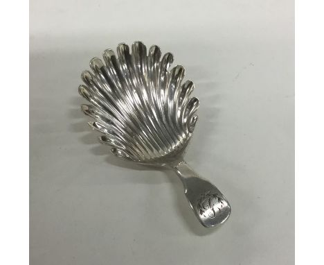 A Scottish silver caddy spoon with fluted bowl. Approx. 13 grams. Est. £40 - £60.