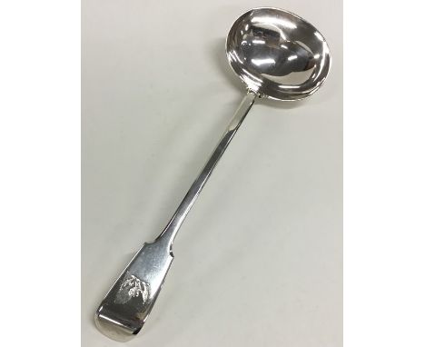 A large fiddle pattern silver soup ladle with crested terminal. London 1836. By Albert Savory. Approx. 301 grams. Est. £250 -