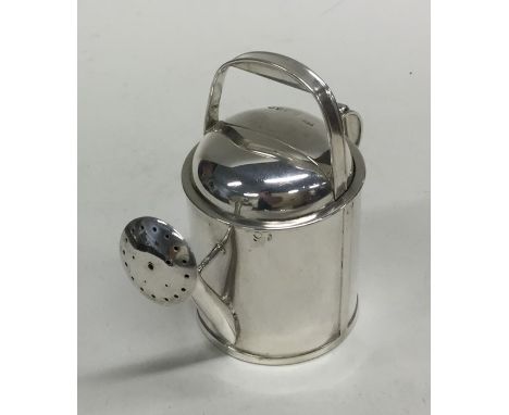 A novelty heavy silver watering can with spring mechanism. London 1885. By William Gibson &amp; John Langman. Approx. 138 gra