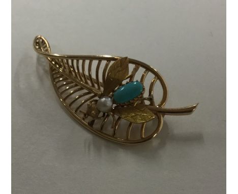 An unusual pearl and turquoise brooch in the form of a gold leaf inset with fly. Approx. 8.2 grams. Est. £400 - £500. 