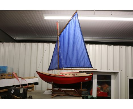 Battery powered r/c wooden sail boat on plinth with sails approx 34 inches long