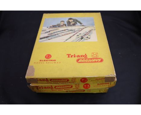 Four boxed Triang TT train sets to include T1 with Merchant Navy Class engine, T4, T5 & T10 all appearing comeplte with locom