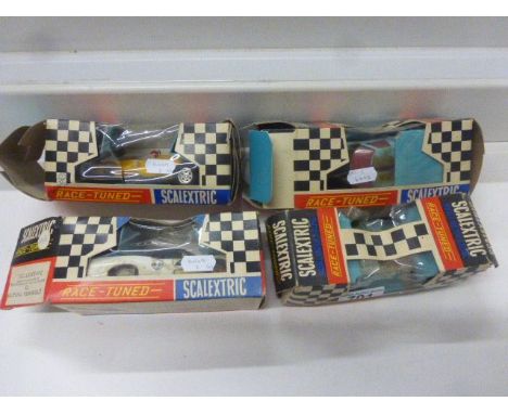Four boxed Scalextric Race Tuned slot cars to include C79 Offenhauser Front Engine Grand Prix in white, C77 Ford GT in pale b