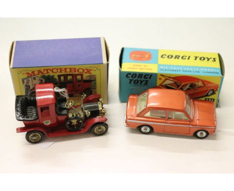 Boxed Corgi 251 Hillman Imp diecast vehicle in metallic bronze with white middle stripe, with suitcase, one bottom side of ve