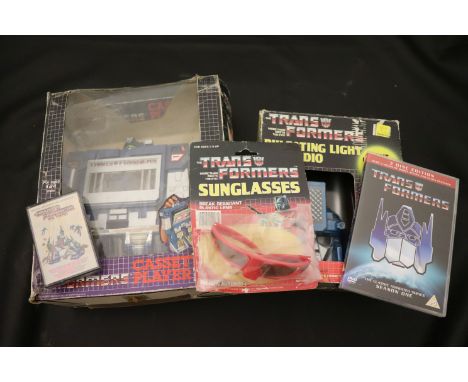 Collection of Transformers collectable's, toys and books to include boxed Tyco Electric Racing Set, boxed Cassette Player, bo