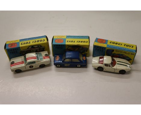 Three boxed Corgi diecast vehicles to include 325 Ford Mustang Fastback 2+2 Competition model in white with red stripes and r