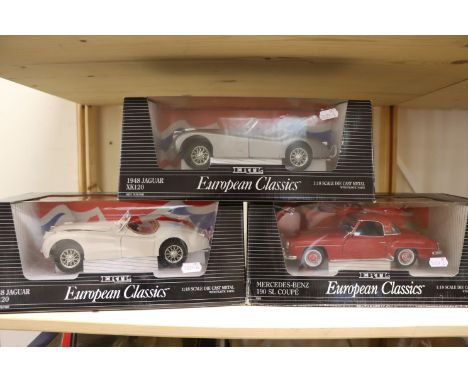 Three boxed ERTL 1:18 scale diecast vehicles to include 7475/7482 1948 Jaguar XK120 in white, 7475/7492 1948 Jaguar XK120 in 