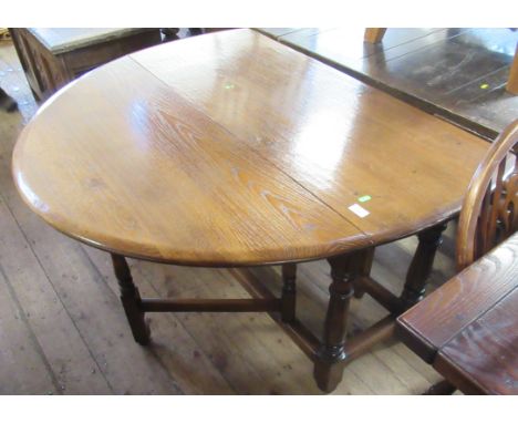 An oak gate leg table, width 46ins
