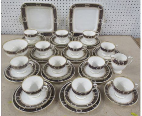 A Wedgwood part tea service, comprising 12 cups, 12 saucers, 11 side plates, 2 square plates, a jug and a sugar bowl