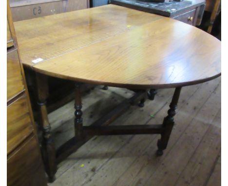 An oak gate leg table, width 43ins