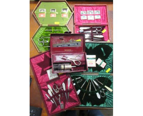 Five 19th century cased sewing sets, some with mother of pearl handled tools