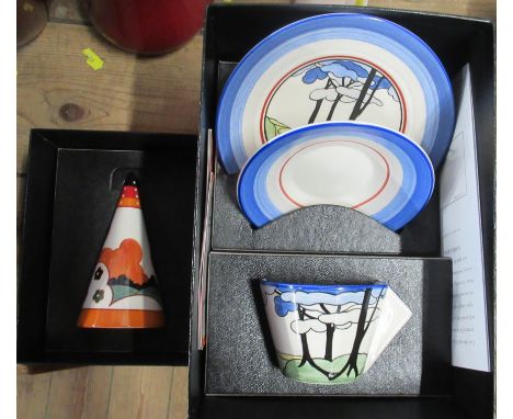 A Wedgwood Clarice Cliff design conical sugar sifter, together with a trio, boxed with certificates
