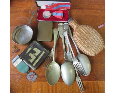 A collection of items, to include flatware, a wicker covered flask, a Stratton compact, a small brass sauce pan and medals