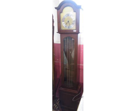 A modern longcase clock, with weights and pendulum