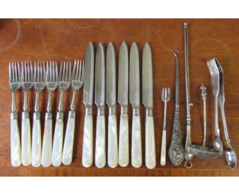 A set of six mother of pearl dessert knives and forks, with silver blades, together with other silver items