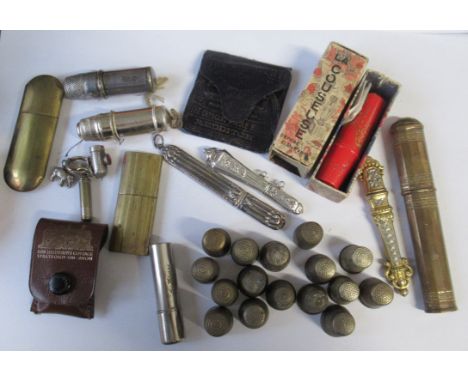 A collection of sewing related items, to include thimbles, bobbin cases, needle cases, etc