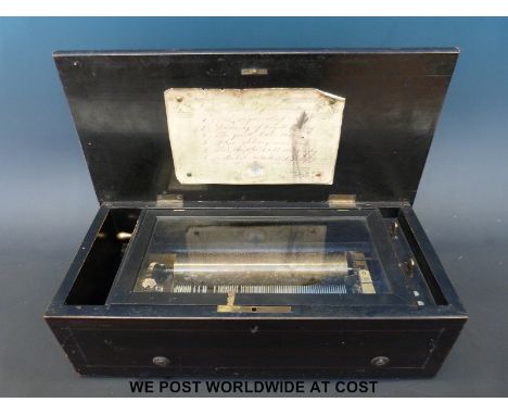 A cylinder musical box playing six airs with original tune sheet under the lid, the mechanism playing on a brass bedplate, ga